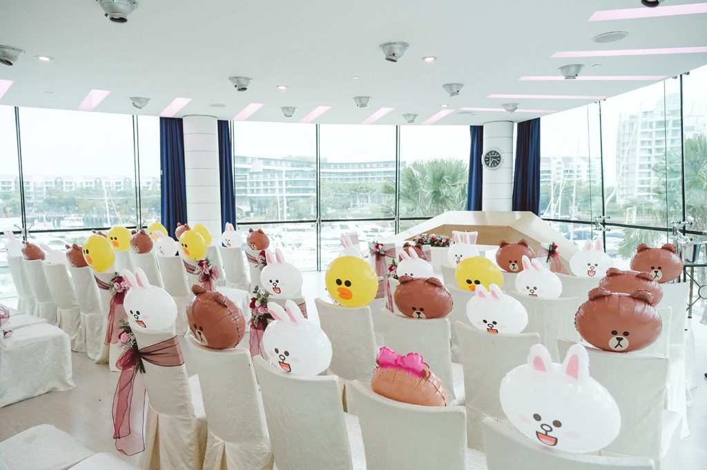 Wedding reception venue decorated with LINE Friends character balloons at Singapore waterfront