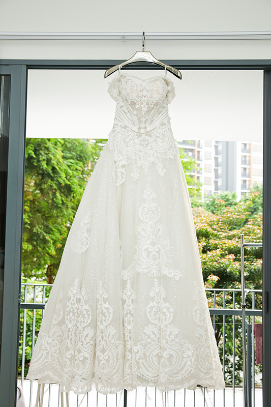 Bride in white gown with cathedral veil bridal portrait at garden venue Singapore
