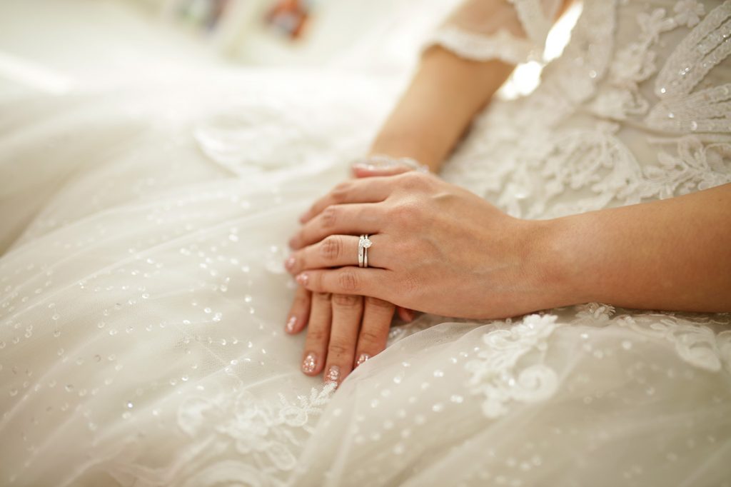 Close-up of bride wedding ring and engagement ring detail shot Singapore
