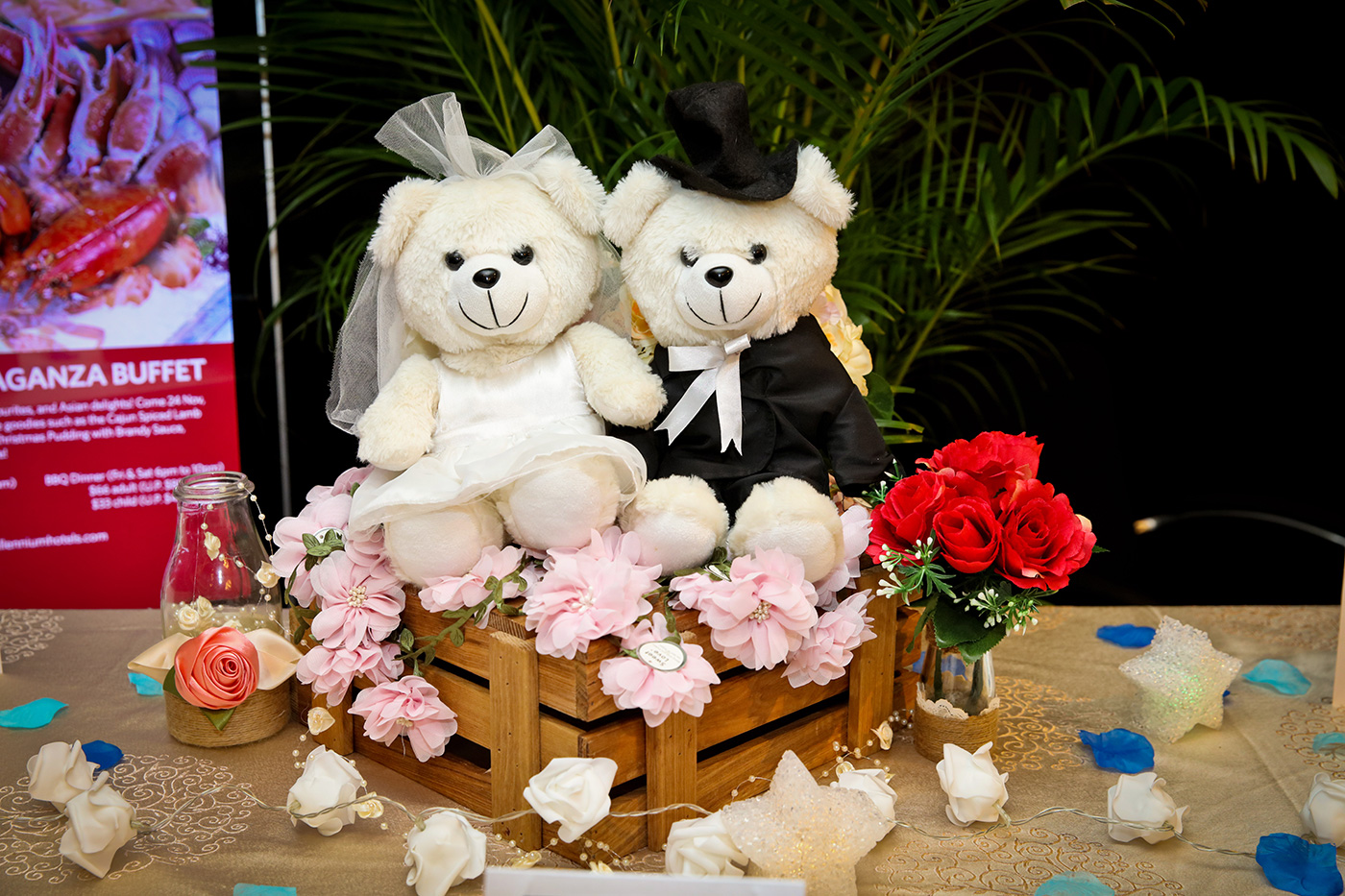 Wedding teddy bear couple decoration with flowers at Singapore reception entrance