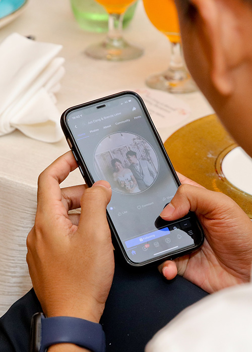 Smartphone showing wedding day photo for instant sharing by iSnap Photography Singapore