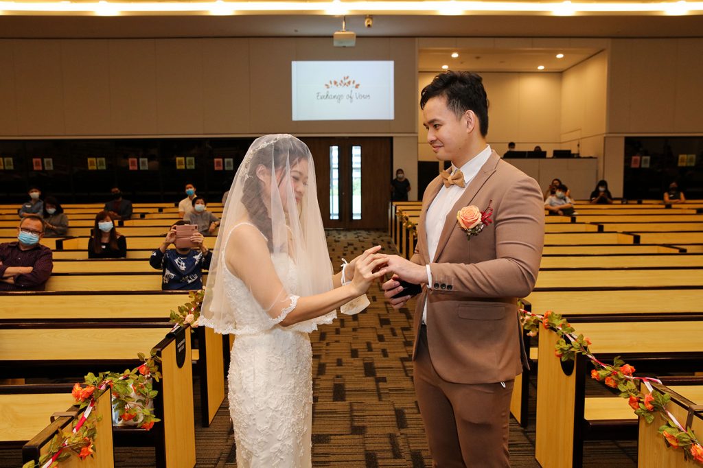 Church wedding ring exchange ceremony at Singapore church altar