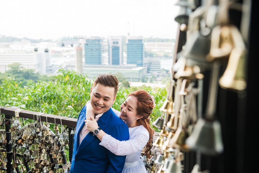 Wedding couple selfie with Marina Bay Sands Singapore skyline in background