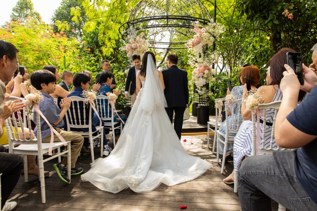 Actual day wedding photography Singapore — bride at a garden ceremony