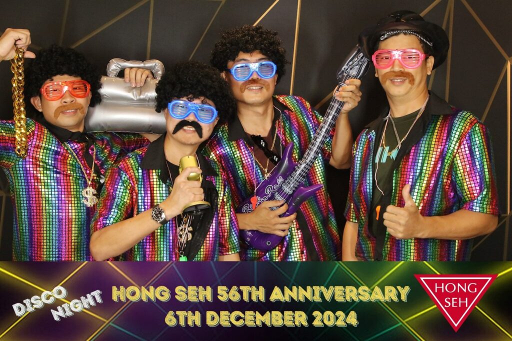 Photo booth vs 360 booth Singapore — event guests with props